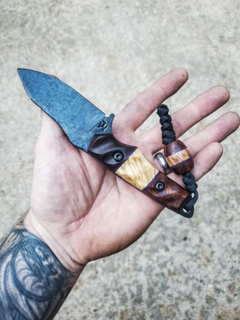 80crv2 with Koa, old growth Red wood and box elder split. Royal purple G10 liners.
