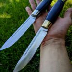Finished these two puukkos as a part of the commission! What do you think of them? I really like the brass one. N690 steel, 60 hrc.