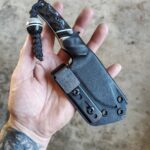 Headed out, 80crv2 with Carbon fiber and gray G10 and white liners.