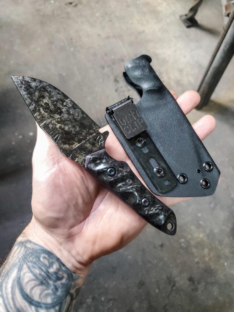 80crv2 with Carbon fiber and Royal purple G10 liners,Granite finish.