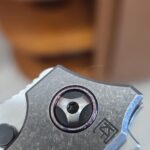 NKD#2: CKF Persian, and a little backstory. Knife: 3.75" M390 blade, high hollow ground. One piece integral titanium frame. Dual row phosphor bronze ceramic bearings. Timascus pivot collar and clip. Backstory:My late wife used to have custom folders made for me. This one is very similar to 1 of them