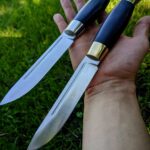 Finished these two puukkos as a part of the commission! What do you think of them? I really like the brass one. N690 steel, 60 hrc.