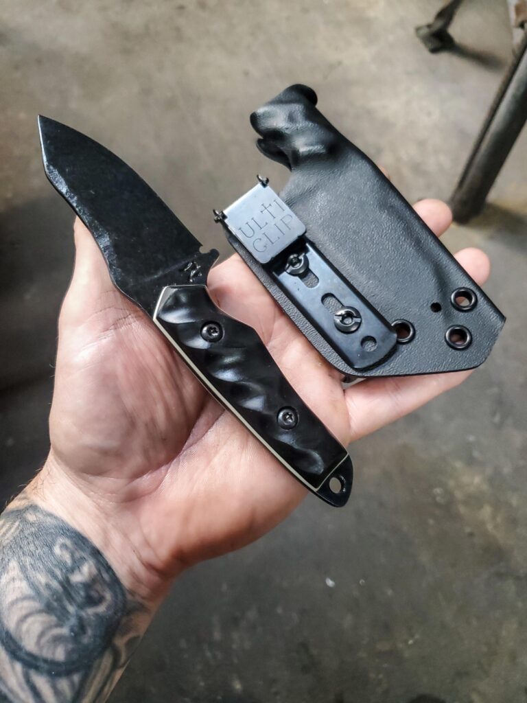 80crv2 with cold Blue finish and black G10 and white G10 liners.