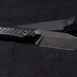 A stealthy EDC bowie just finished. Z-Wear @ 63HRC, carbon and some blue liners