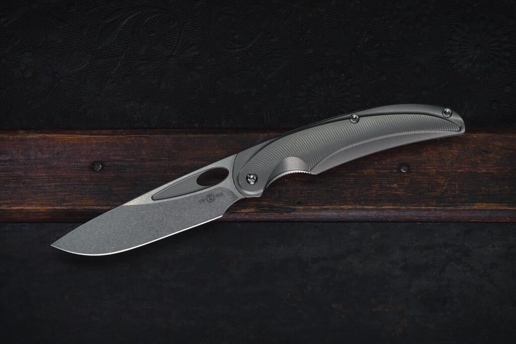 TwoSun TS455. All that contoured and milled Ti yet still a budget knife.
