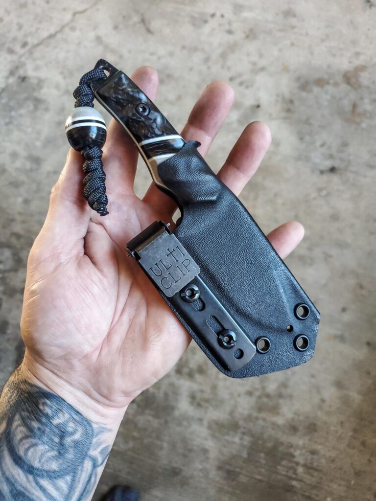 Headed out, 80crv2 with Carbon fiber and gray G10 and white liners.