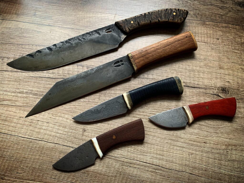 A few custom knives made by Hellize Ironworks