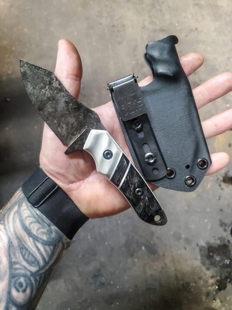 80crv2 EDC Granite finish with carbon fiber and grey G10 and white G10 liners.