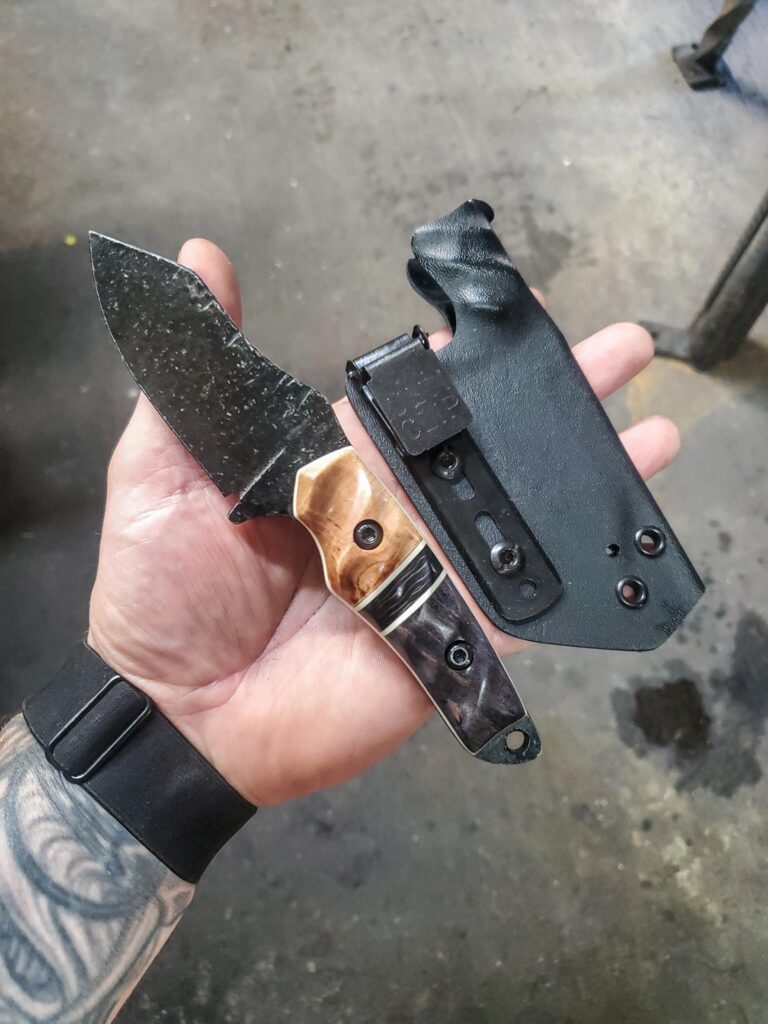 80crv2 with Karelian Birch and apocalyptic mango and carbon fiber split, Ivory G10 liners.