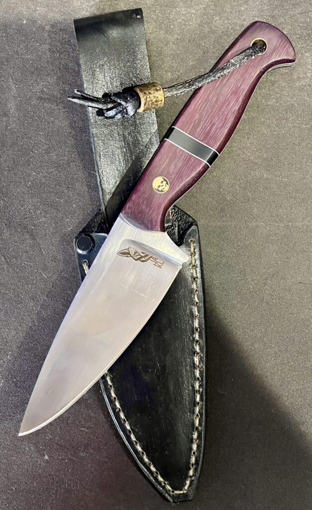 No big names on this one. Custom hunting knife with N690 and purple Heartwood made by a local South African knifemaker