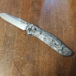 My Benchmade 940 Osborne with Lazer engraved kraken scales