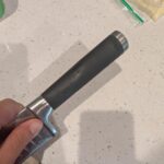 Sticky stuff on rubber handle keeps appearing after washing. Should I get a new handle?