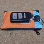 Is there a slim zipper wallet that has a little pouch for a key fob?