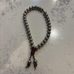 As someone who follows Buddhist teachings, I sometimes carry a mala on me. Here is one i recently made.