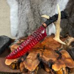 A single-edged blade made of red glass.