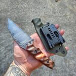 80crv2 Acid washed with burlap Micarta and Karelian Birch split and red G10 Liners.🤙