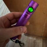 How do I turn off the green indicator light on the button on my Sofirn?