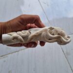 The octopus knife handle is carved from deer antler.