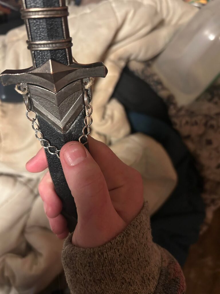 I was given this dagger that is actually pretty decent, but the chain that wraps around my belt is flimsy. Could I replace it with anything? Could I reinforce it somehow?