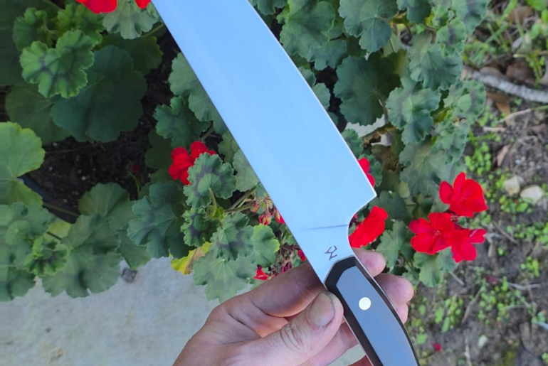 15n20 Chef fly around with black G10 and white G10 liners and brass pins.