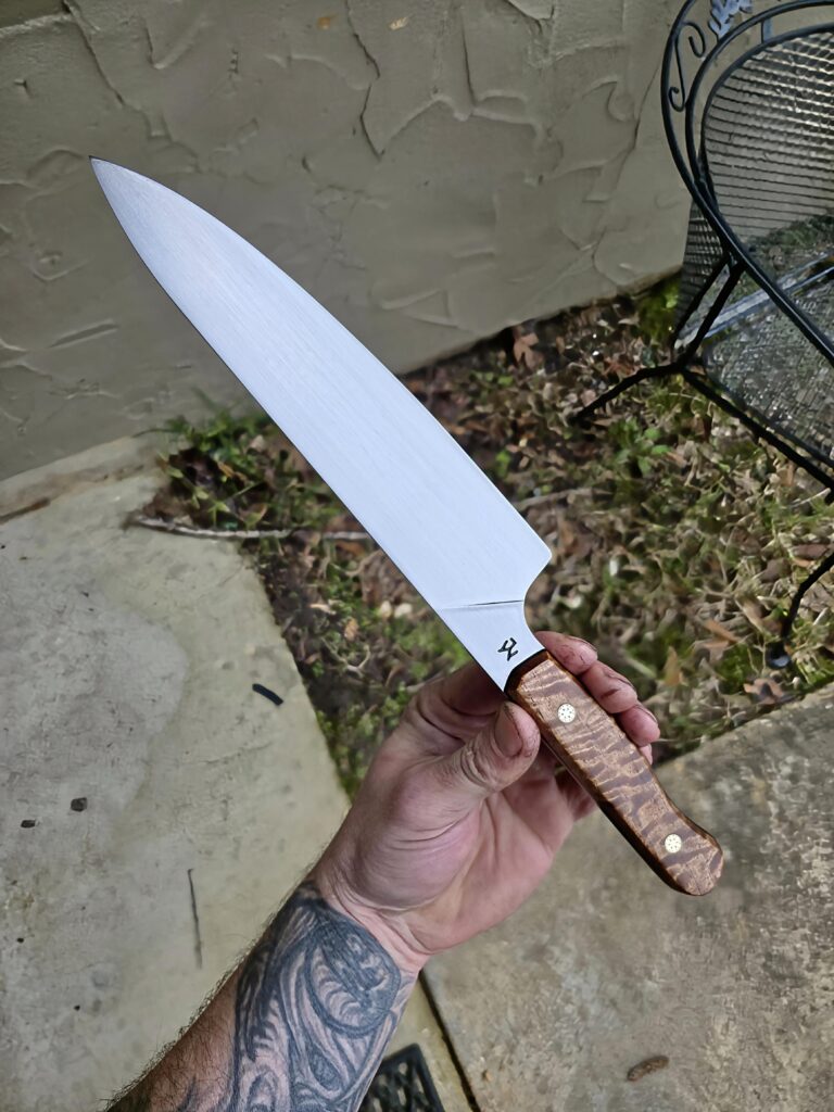 Finished up this Chef Knife, steels 15n20, Quilted Maple handle🍁