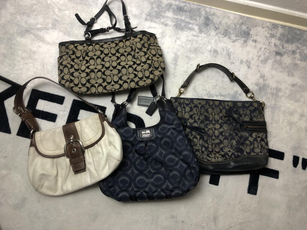 What are the prices of vintage Coach bags if I were selling them as a private shop, slightly below the main market prices in order to have an advantage over other stores?