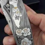 Hand-engraved titanium knife scale by Noblie