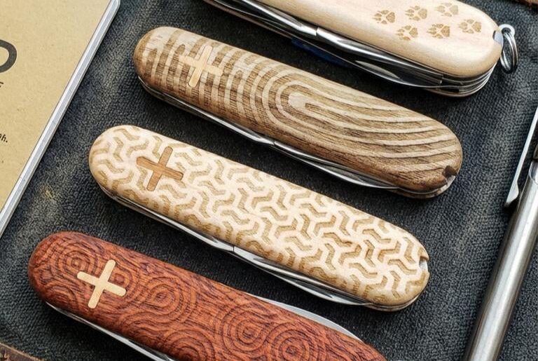 Custom engraved wood scales on the Victorinox 91mm models.