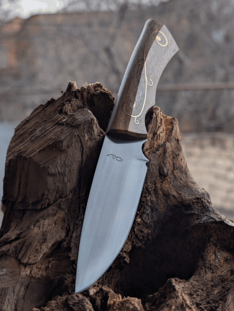 Just finished this one. Made of 9KhF, Soviet chromium-vanadium high carbon steel, Handle of Walnut with brass inlay and pins. 58-59 HRC. DM if interested