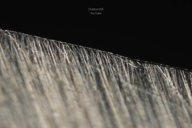 Microscopic view of a knife dulling in real time against cardboard [credit: OUTDOORS55 on Youtube]