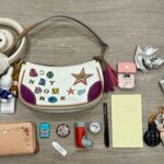 kinda cheating since i hang my headphones on the strap. you can also fit a lot when you shove your receipts in any crevice lol