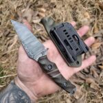 1084 Acidwashed finish with OD Green Sandblasted Burlap Micarta, Splits natural Burlap Micarta with OD Green G10 and Earth Brown G10. Liners are OD Green G10.