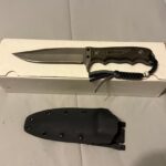 Can anyone tell me more info about this knife? I can't figure out the maker