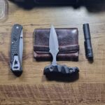 Here's my EDC: A Kaowz push dagger, a homemade wallet, a Buck 110 slim pocket knife, and a Microlight Stream Light flashlight.