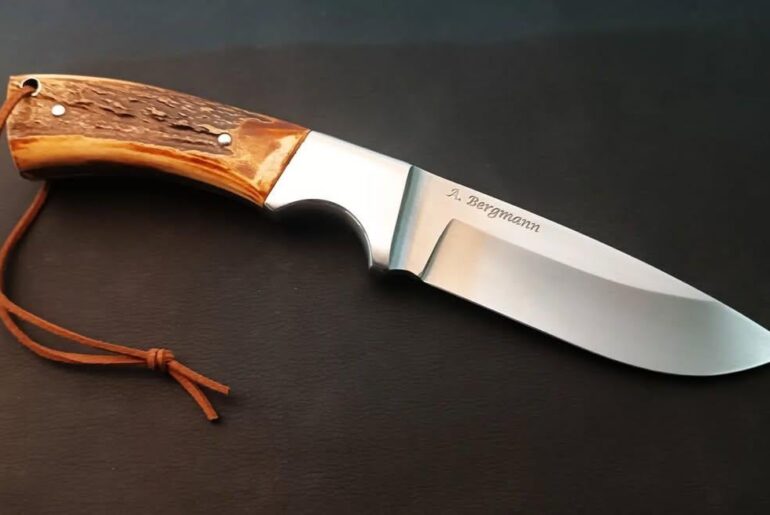 Hunting knife, forged from carbon steel with an integral bolster.