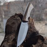 My latest one. Made of 9KhF, Soviet chromium-vanadium high carbon steel, Handle of Walnut with brass inlay and pins. 58-59 HRC. DM me if interested