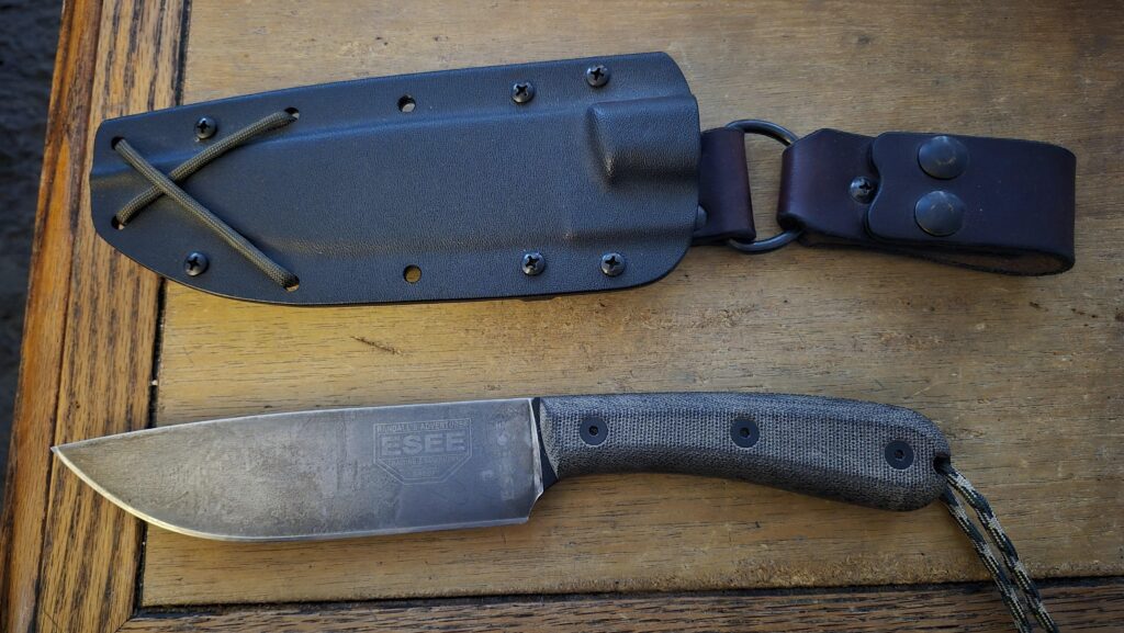 Esee 6, semi customized. I reprofile the edge and did a forced patina.