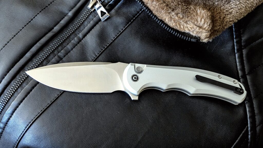 button lock civivi praxis... the ergonomic grip wants to be held, it begs to gripped up just so it can whisper to you, "that's right bitch, that's right"