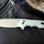 button lock civivi praxis... the ergonomic grip wants to be held, it begs to gripped up just so it can whisper to you, "that's right bitch, that's right"