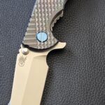 Hinderer XM-18 3.5" harpoon spanto with Oil Slick Zirconium scale.