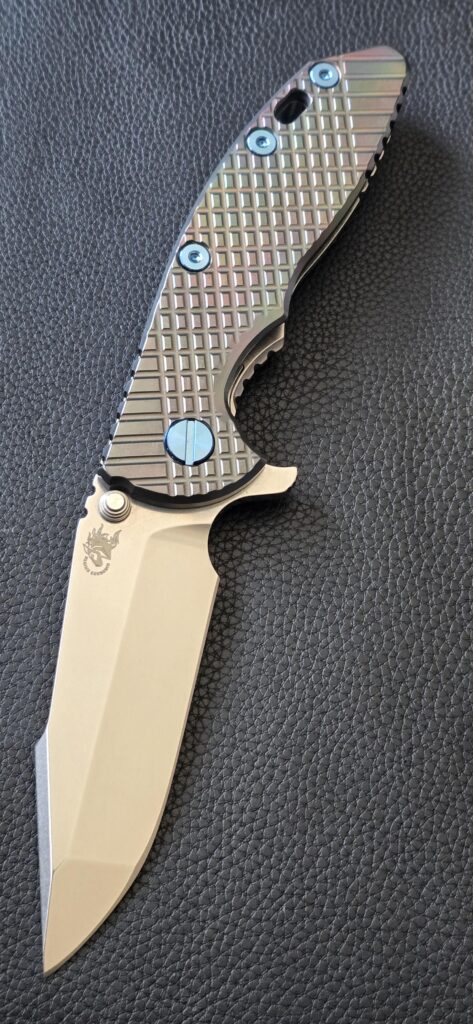 Hinderer XM-18 3.5" harpoon spanto with Oil Slick Zirconium scale.