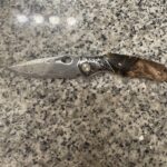 Can someone identify this knife and tell me what it could be worth?