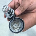 How do I extract swollen corroded alkaline batteries out of my Maglite 3D LED flashlight?