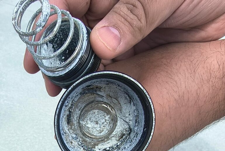 How do I extract swollen corroded alkaline batteries out of my Maglite 3D LED flashlight?