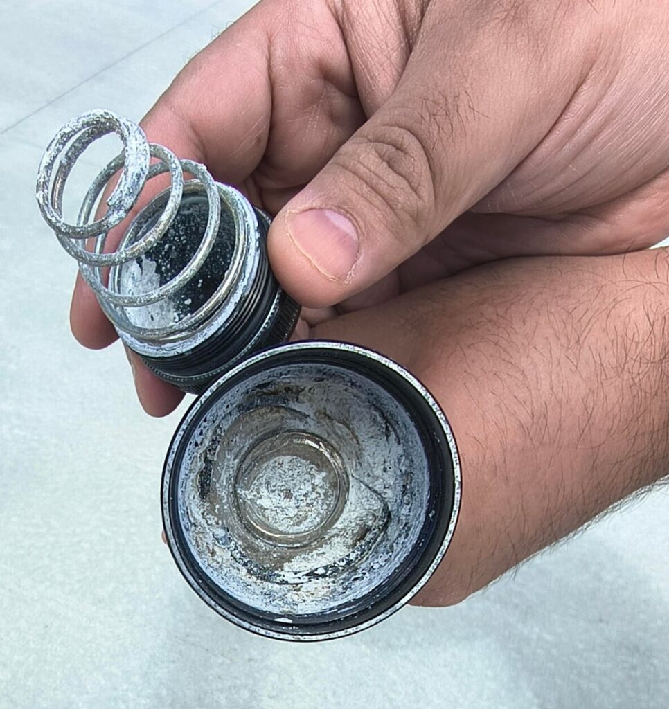 How do I extract swollen corroded alkaline batteries out of my Maglite 3D LED flashlight?