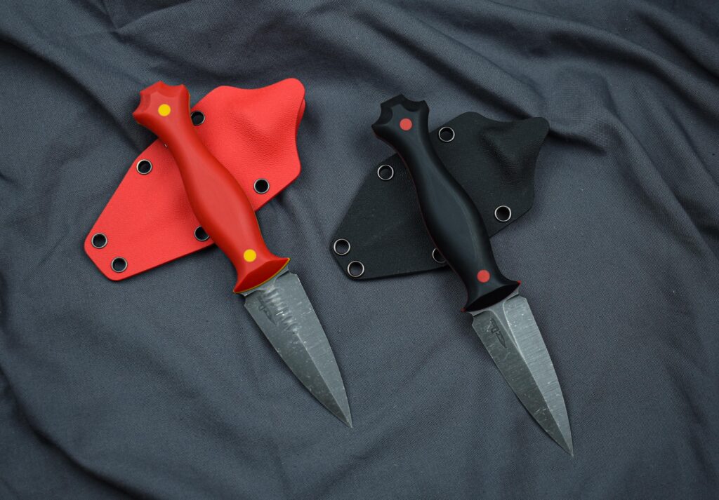 Two new daggers in 14C28N at 60HRC with G10 scales, liners and pins, kydex sheaths. How do you like them?