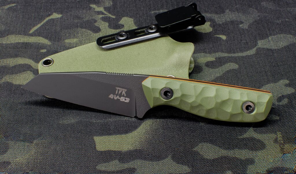 CPM 4V wharncliffe, one of my favourite smaller designs. Black Cerakote, OD G10, orange liners