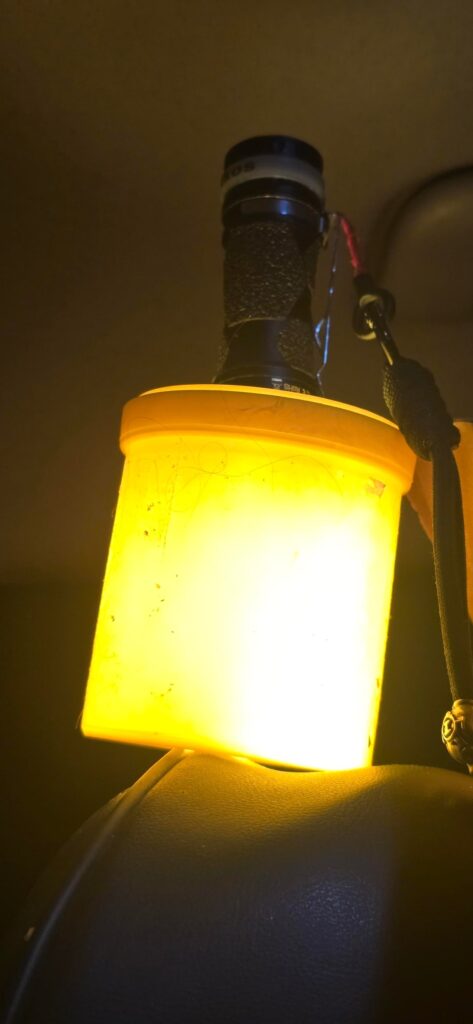 Jury rigged lantern attachment from a candy container.
