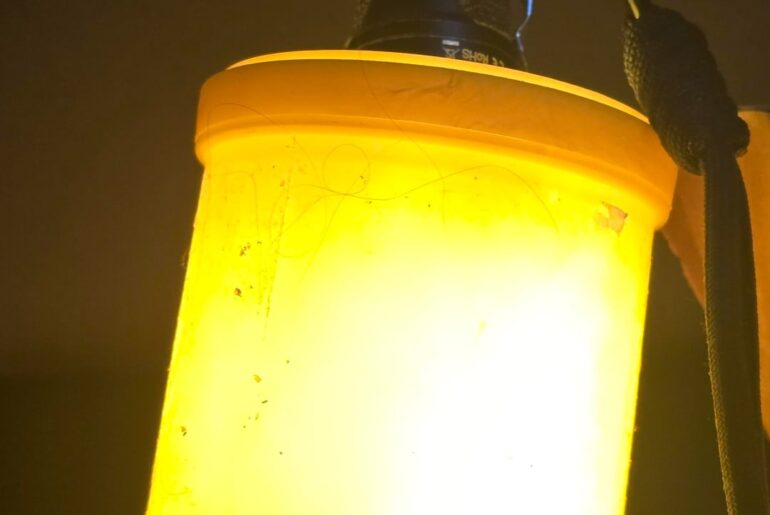 Jury rigged lantern attachment from a candy container.