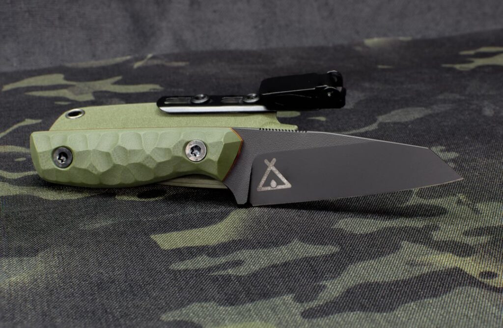 CPM 4V wharncliffe, one of my favourite smaller designs. Black Cerakote, OD G10, orange liners